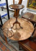 Beaten copper tray table on stand and a wine table on tripod supports (2)