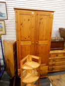 Modern pine two-door wardrobe enclosed by field panelled doors and fitted two drawers to base,