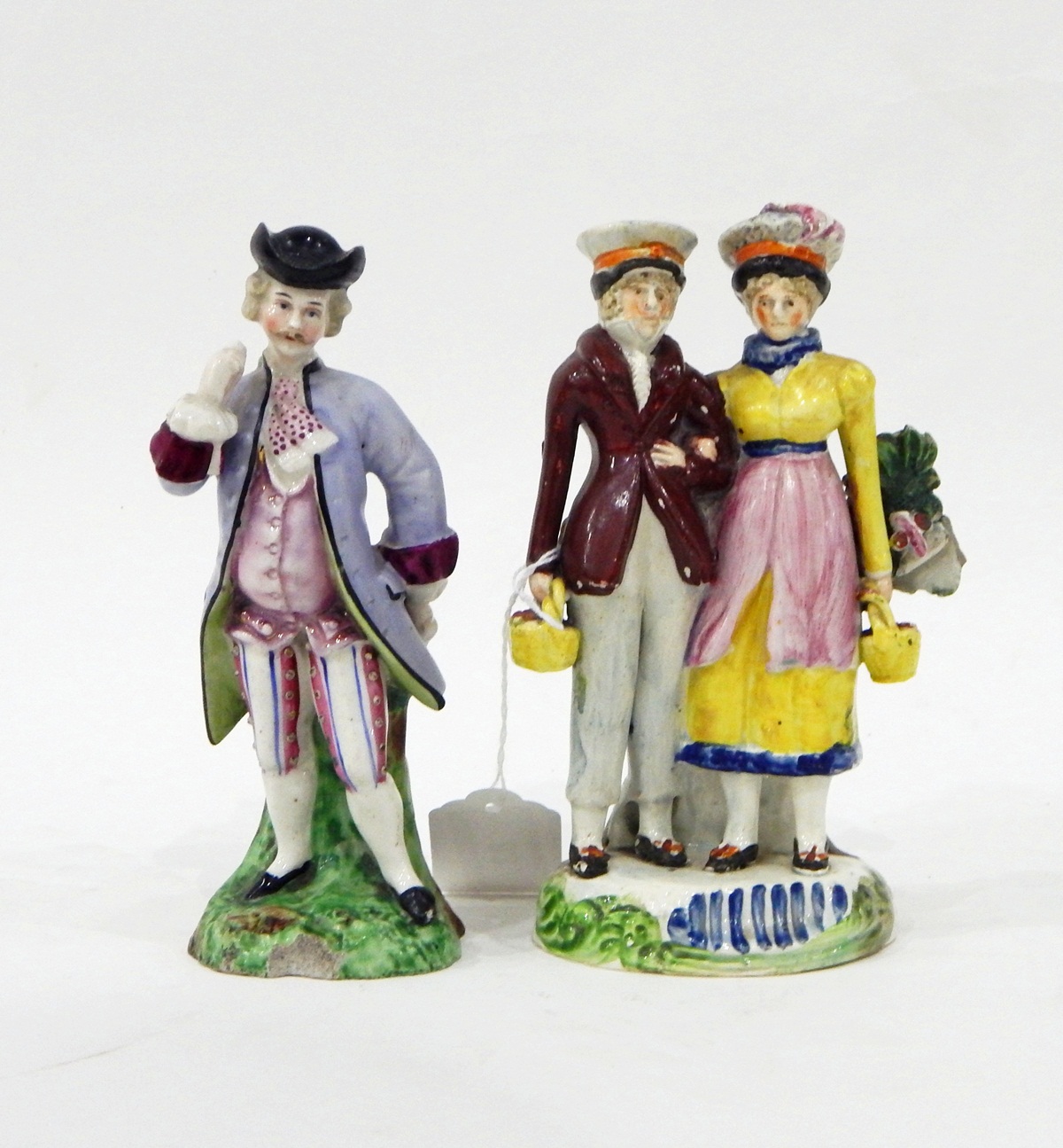 19th century pottery figure of a gentleman and lady,