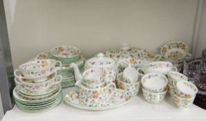 Minton part table service in the 'Haddon Hall' pattern, comprising oval vegetable dish and cover,