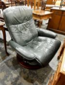 Green leather upholstered recliner swivel easy chair