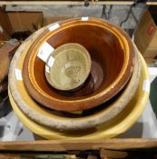 Three large earthenware bowls and a jelly mould (4)