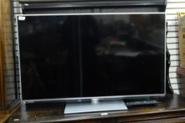 Panasonic flat screen television, 42 ins, with remote.