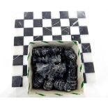 Modern marble chess board with carved variegated chessmen