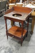 Victorian mahogany washstand with three-quarter gallery, the under-tier fitted a drawer,