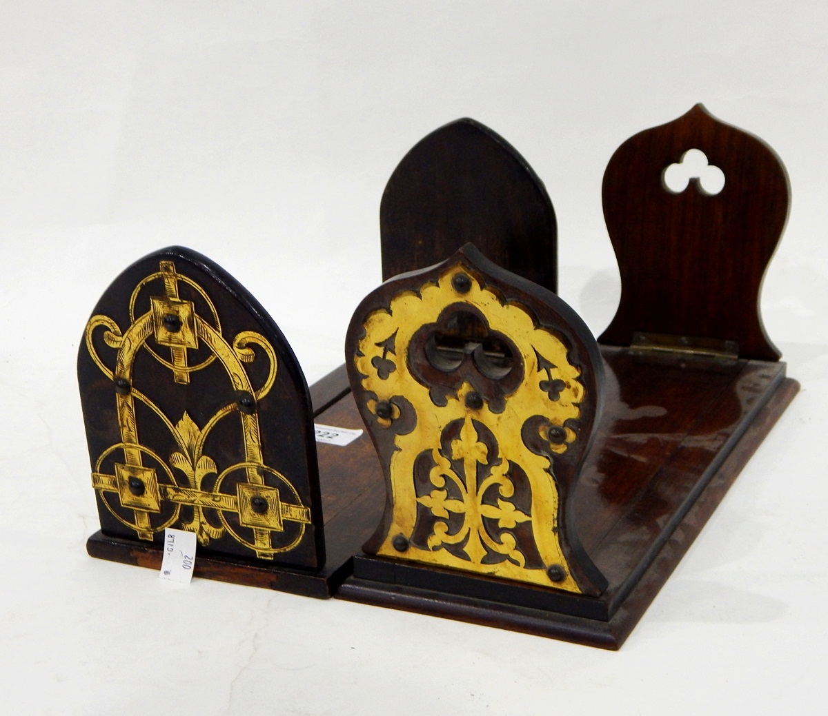 Victorian mahogany bookslide with Gothic-style brass mounts and another similar example,