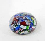 Glass scrambled millefiori paperweight of shallow domed form,