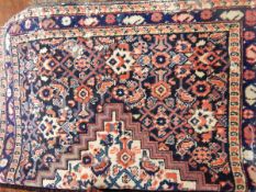 A wool Eastern rug,