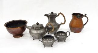 Pewter four piece teaset of circular hammered form, an Arts & Crafts hammered copper jug,