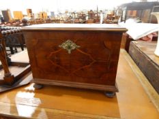 Antique walnut veneered box, with stringing and brass escutcheon, bun feet and end carrying handles,