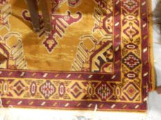Eastern-style wool runner, the ochre ground with two shaped hooked medallions, geometric borders,
