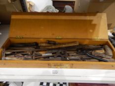 Wooden tool box containing tools