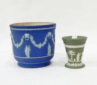 Wedgwood Jasperware jardiniere decorated with garlands and figures on a blue ground,