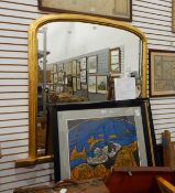 An overmantel mirror of rectangular form with arched top, in moulded gilt frame,