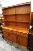 1960's/70's teak-finish dresser with plate stand, three short drawers, cupboard underneath,