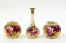 A pair of Royal Worcester vases of globular form, painted with roses on an ivory ground, 7.