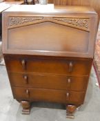 20th century stained oak writing desk, the flap opening to reveal fitted pigeonhole interior,