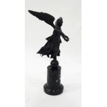 A bronze figure of Victory, the winged female figure holding a wreath,