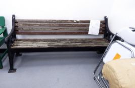 A slat back Coalbrookdale-style cast iron garden bench