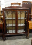 Mid to early 20th century mahogany bowfront china display cabinet enclosed by bi-glazed doors and