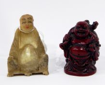 An Oriental carved jade seated figure of a sage,