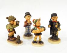 12 Goebel figures including a boy with binoculars and rabbit at his feet,