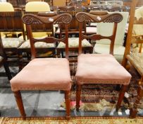 Pair of Victorian mahogany dining chairs with shaped top rail, pink stuffover seat,