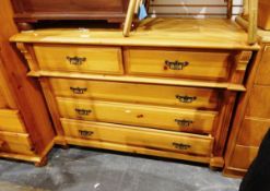 Pine chest of two short and three long drawers with Edwardian-style brass handles,