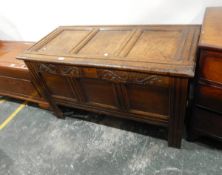 Early 18th century oak three-panelled coffer on stile legs and with carved frieze,