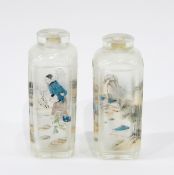 Pair of Chinese glass snuff bottles of square form, internally painted with figures and landscapes,