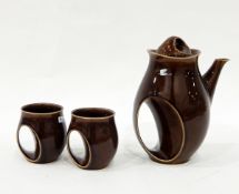 Holkham pottery coffee service decorated in brown glazes, with integral handles,