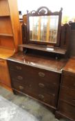 Early 20th century mahogany dressing chest with bevelled plate mirror, on bracket style feet,