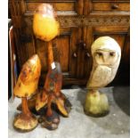 Three various carved garden mushrooms and a chain saw carved wooden owl (4)