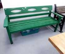 Green painted wooden bench with slat seating and shaped back,