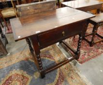 Antique oak side table with single frieze drawer, on bobbin and block supports,