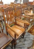 Pair of oak carvers' armchairs with floral and shell decorated top rails, railbacks,
