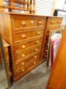 Two modern pine pedestal chests of six drawers with turned knob handles,