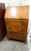 Circa 1940's lady's veneered bureau with pigeonhole interior over four long drawers,