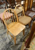 Pair of 20th century stickback kitchen chairs on tapering suupports