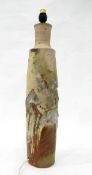 Studio pottery table lamp of textured cylindrical form in grey and brown glazes,