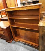 Modern yew finish dwarf three-tier open bookcase on bracket style feet,