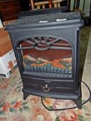 A Warm Lite log effect black metal electric woodburner