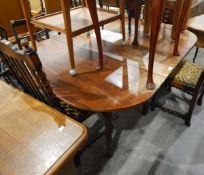 A 19th century mahogany drop-leaf dining table,