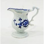 An 18th century blue and white pedestal cream jug, possibly Liverpool,