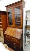 Early Georgian walnut bureau bookcase, fall flap to reveal stepped and fitted interior,