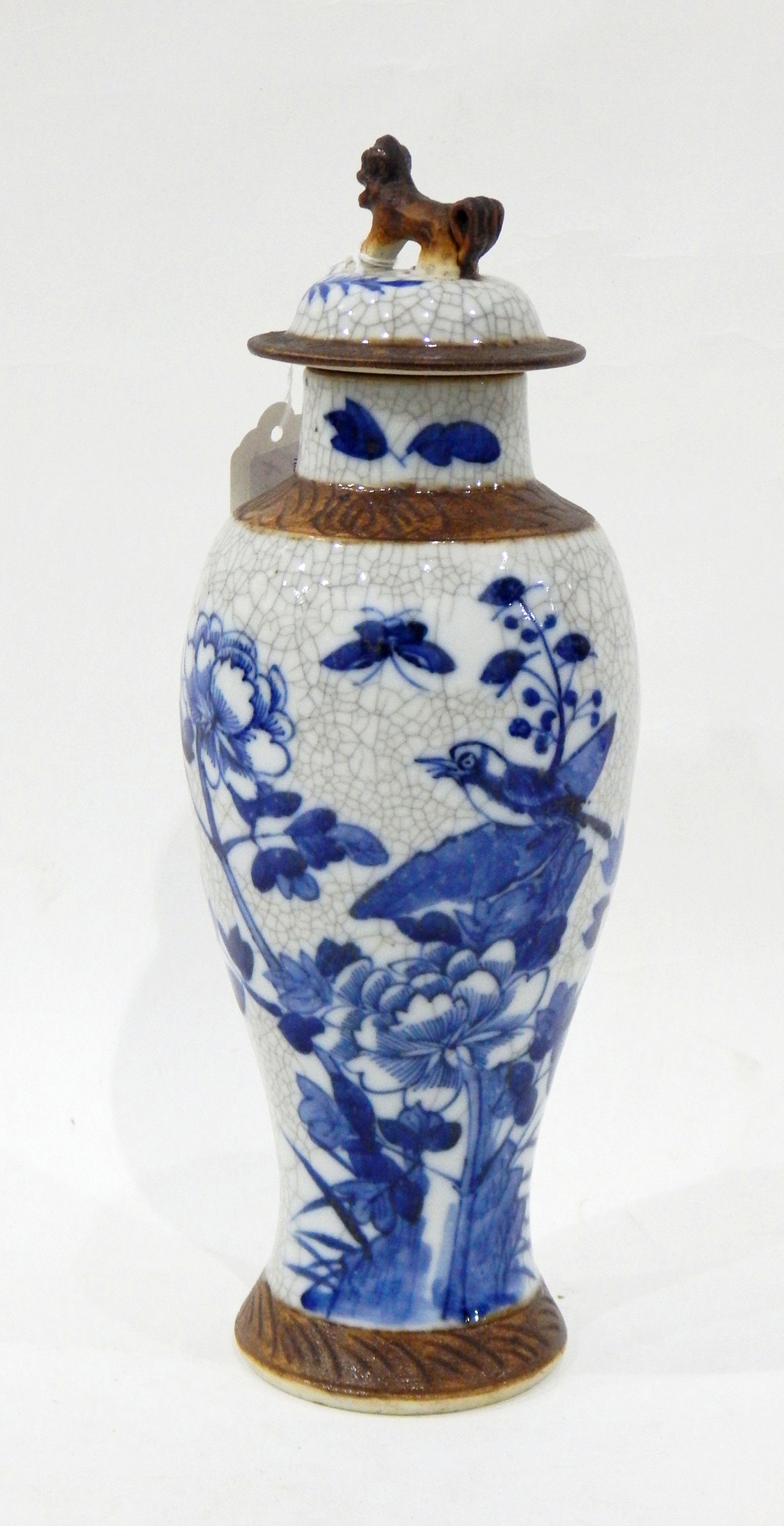 Japanese porcelain blue and white vase and cover decorated with birds and flowers on a crackle