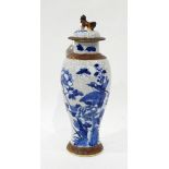 Japanese porcelain blue and white vase and cover decorated with birds and flowers on a crackle