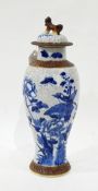 Japanese porcelain blue and white vase and cover decorated with birds and flowers on a crackle