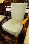 Reproduction nursing chair with green upholstery