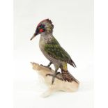Goebel model of a green woodpecker, printed marks and impressed numbers to base, 28cm high,